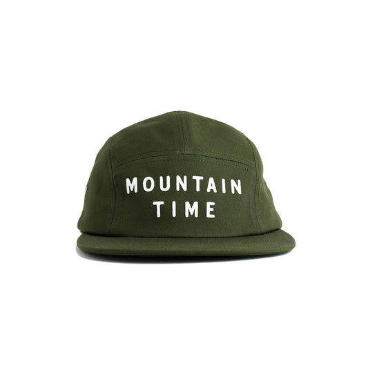 An olive green 5-panel cap with 'MOUNTAIN TIME' embroidered in white block letters on the front, set against a plain white background.