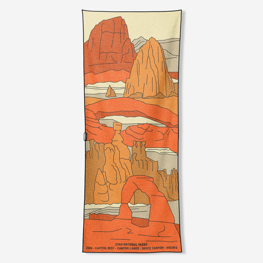 Towel with Arches desert landscape design featuring red rock formations on a white background. 
