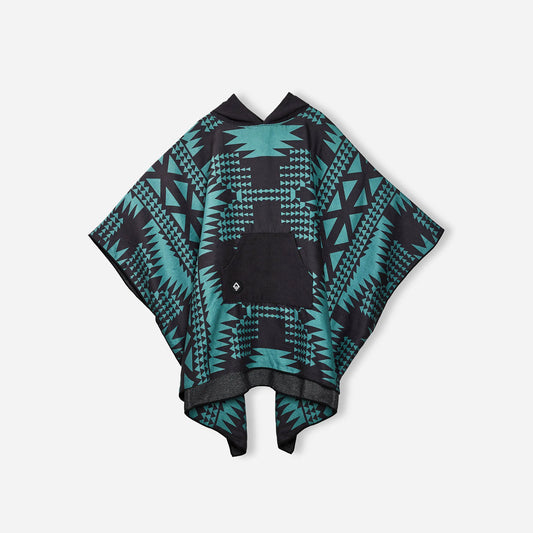 Teal and black patterned poncho on a light gray background