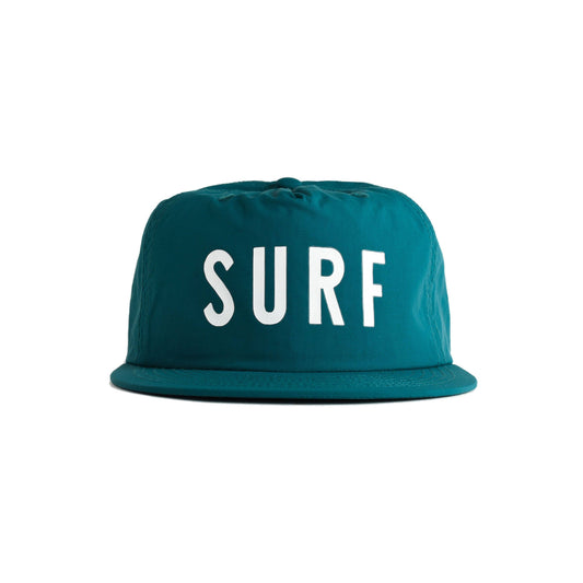 A teal flat-brim baseball cap with the word 'SURF' printed in bold white capital letters across the front, shown against a plain white background.