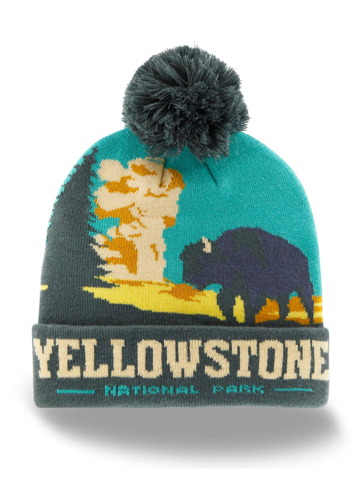 A Yellowstone National Park knit beanie hat featuring a dark teal and gray design with a bison, tree, and sunset motif, topped with a dark gray pom-pom. The folded cuff reads 'YELLOWSTONE NATIONAL PARK' in cream and teal.