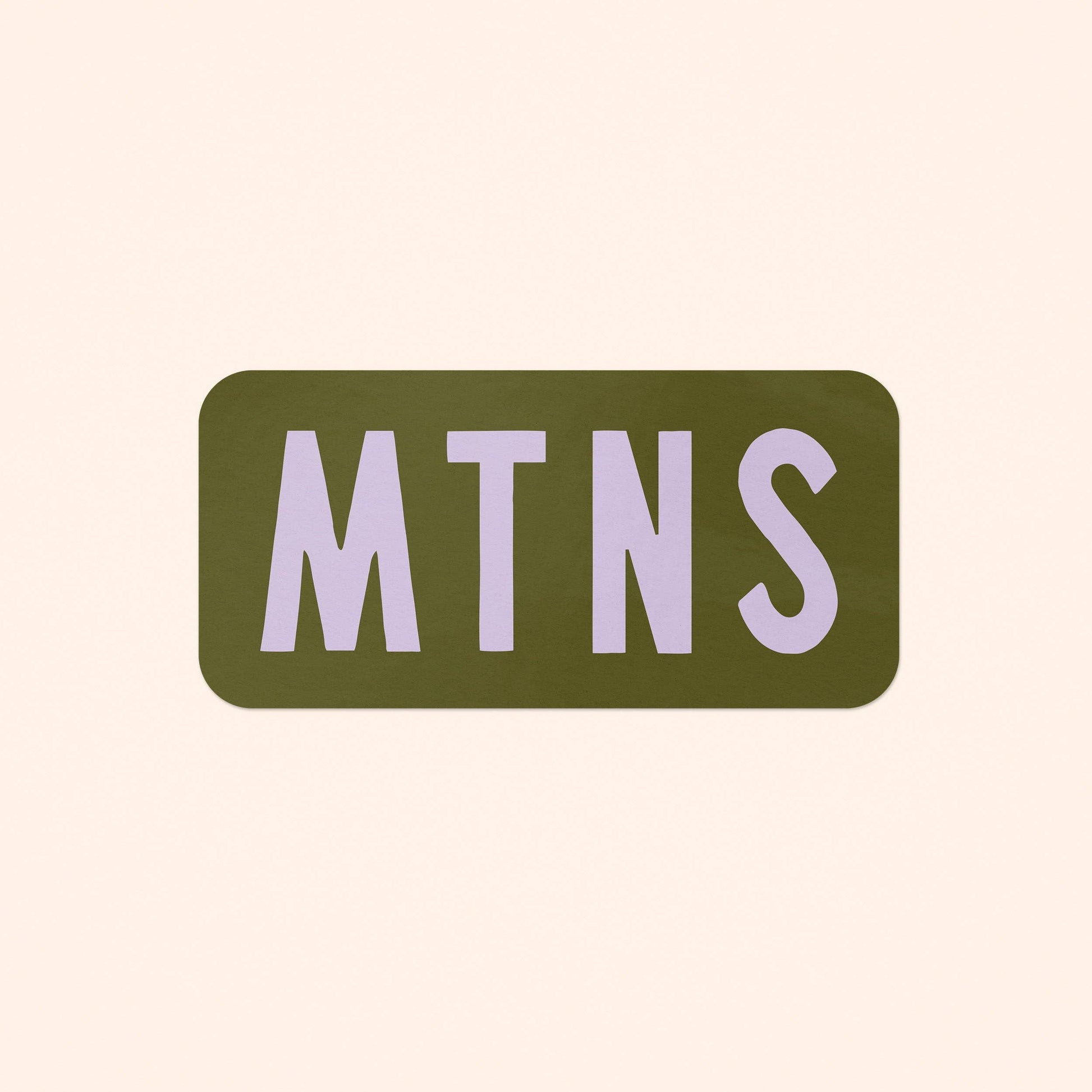 A rectangular sticker with rounded corners featuring the text 'MTNS' in a light lavender-purple serif font on an olive green background, centered on a solid pale beige background.