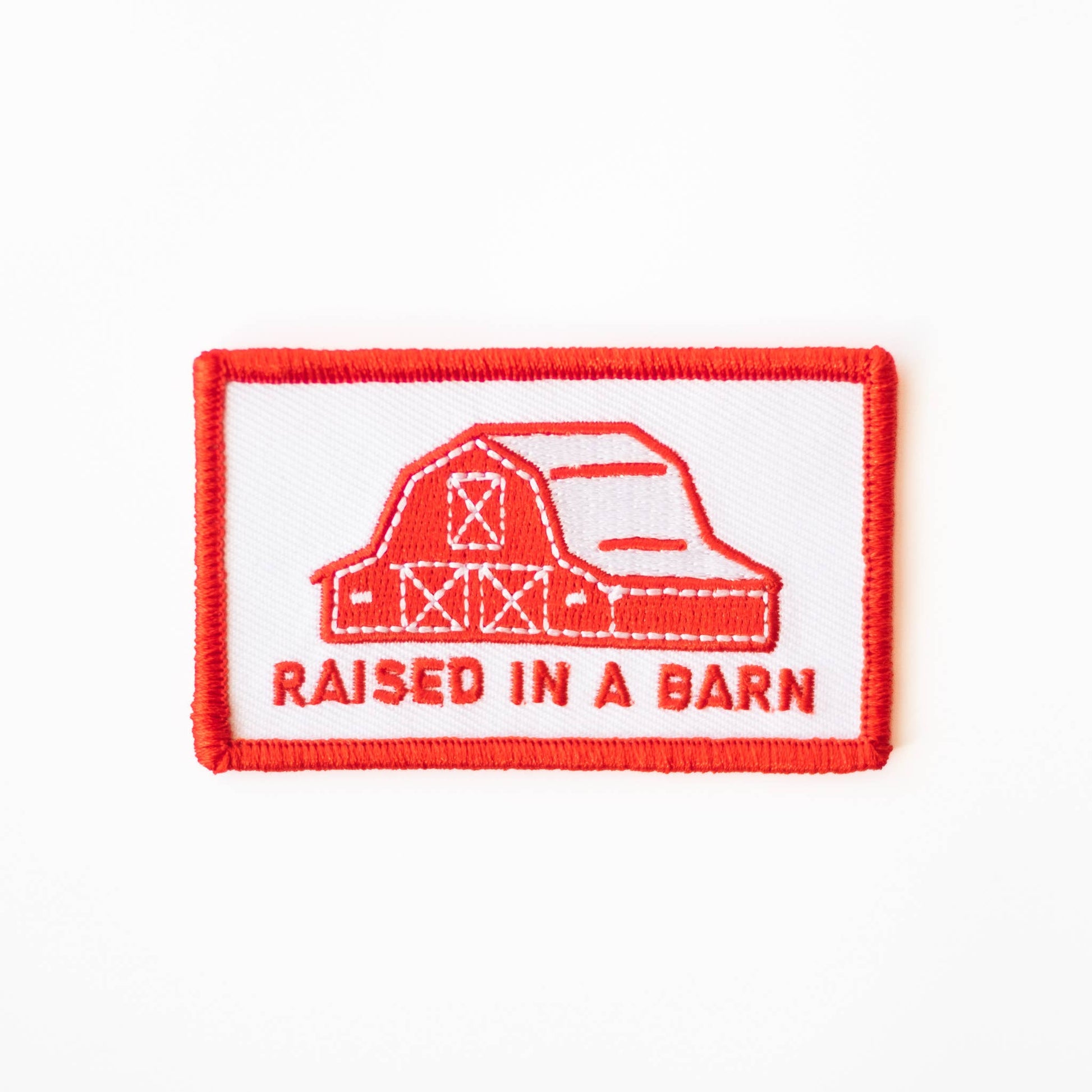 “Raised In A Barn” Embroidered Iron on Patch - Wander Together Outfitters