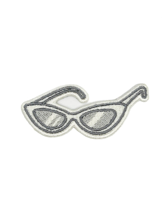 Sunglasses patch with dark lenses on a white background