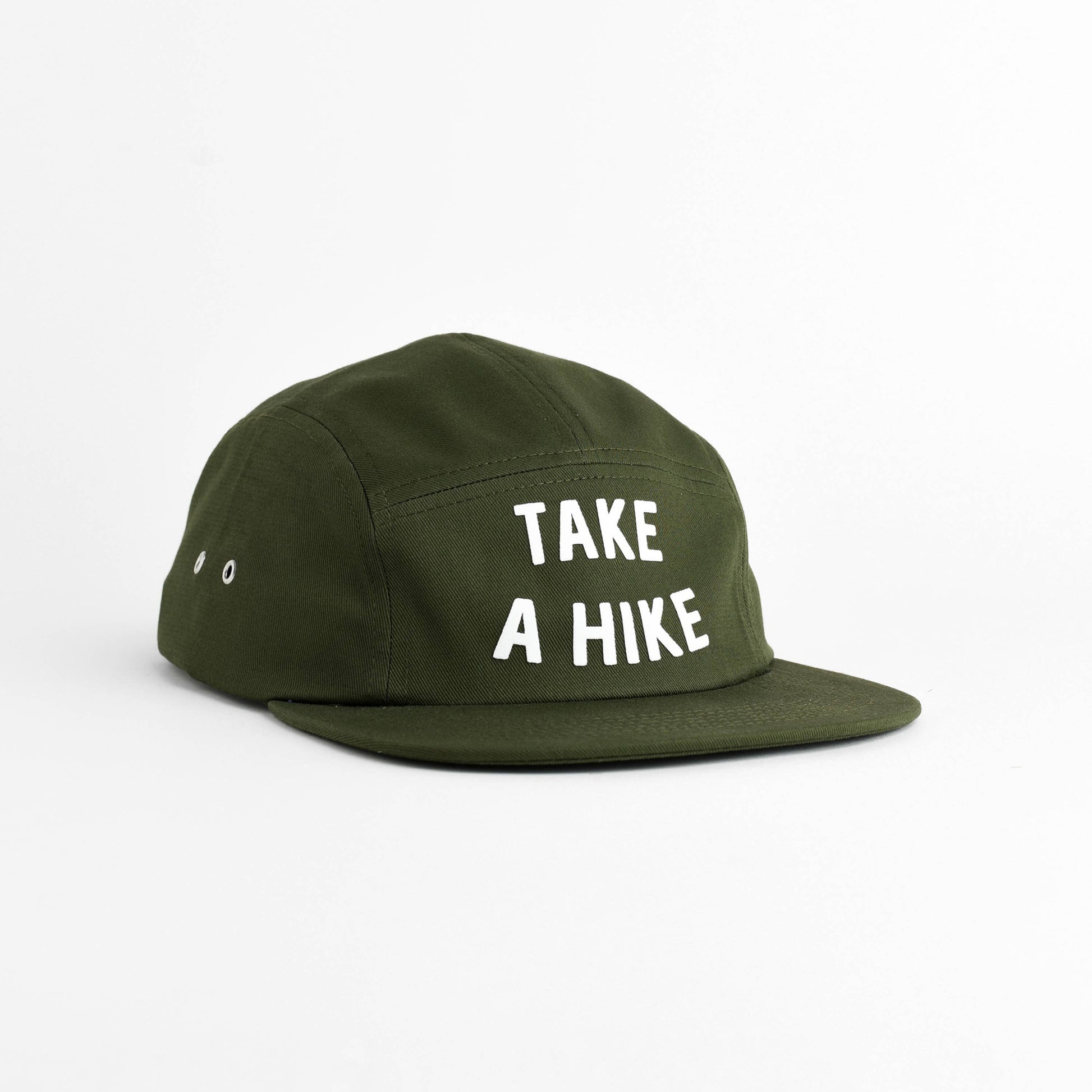 An olive green 5-panel camp cap with the phrase 'TAKE A HIKE' embroidered in white capital letters on the front, set against a plain white background.