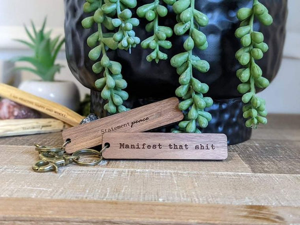 Manifests that *ish wooden tag or keychain
